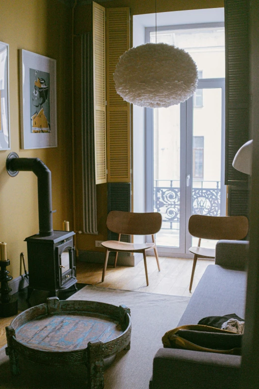 a living room filled with furniture and a fire place, inspired by Emilio Grau Sala, pexels contest winner, light and space, lisbon, between two chairs over a toilet, old apartment, yellow