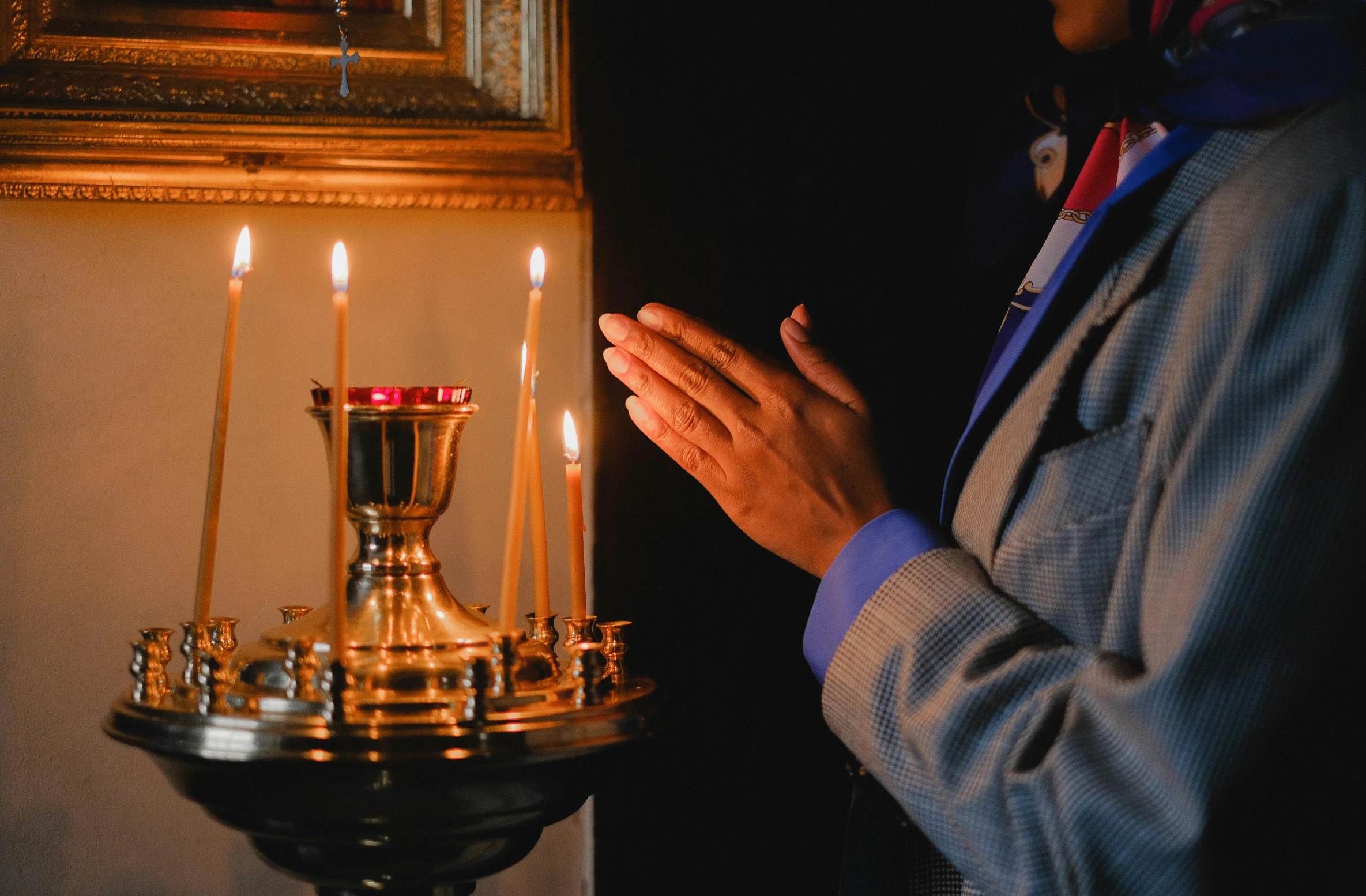 a person standing in front of a lit candle, orthodoxy, fan favorite, profile image, ritual