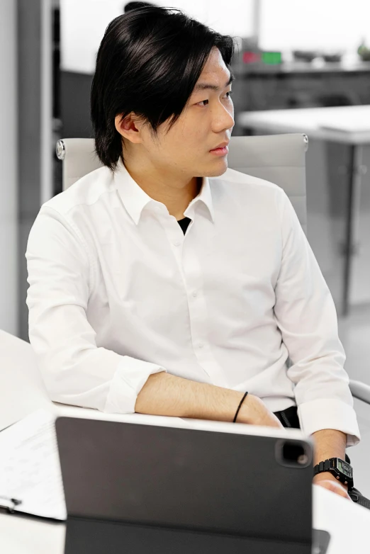 a man sitting in front of a laptop computer, shin hanga, wearing a white button up shirt, sitting on designer chair, avatar image, multiple stories