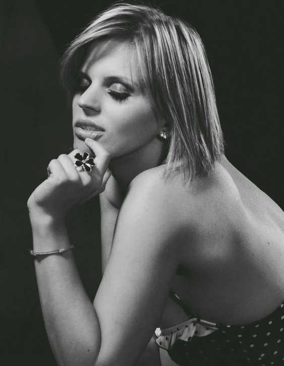 a black and white photo of a woman, side boob, charlize, raphael lecoste, hand on her chin