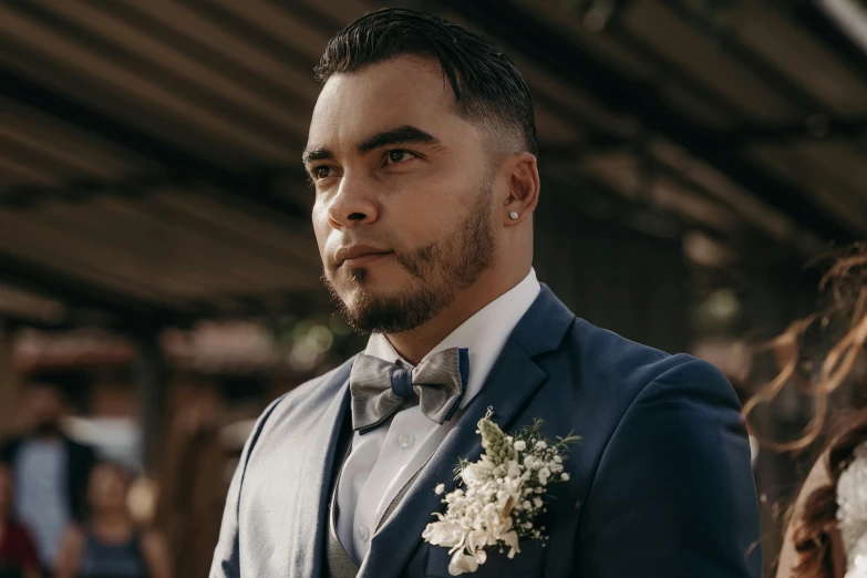 a close up of a person wearing a suit and tie, inspired by Eddie Mendoza, pexels contest winner, hurufiyya, wedding, looking serious, te pae, mid-shot of a hunky