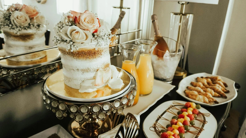 a wedding cake sitting on top of a table, a still life, by Robbie Trevino, trending on unsplash, breakfast buffet, bubbly, thumbnail, hard morning light