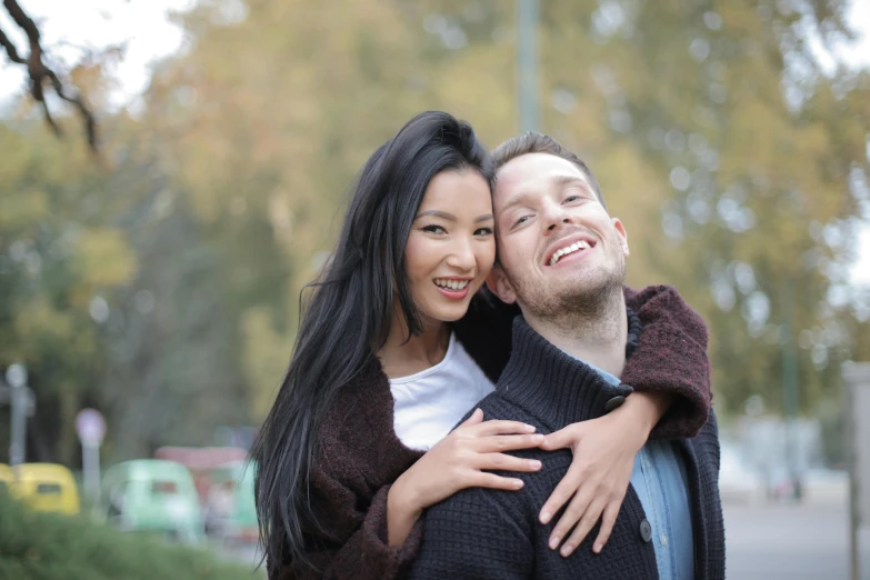 a man and a woman standing next to each other, a picture, pexels, happening, russian and japanese mix, smiling :: attractive, square, embracing