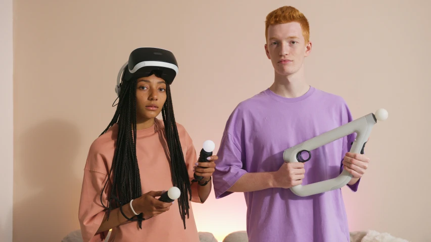 a man and a woman standing next to each other, trending on pexels, renaissance, wearing a gaming headset, teenage engineering moad, mauve and cyan, wearing vr