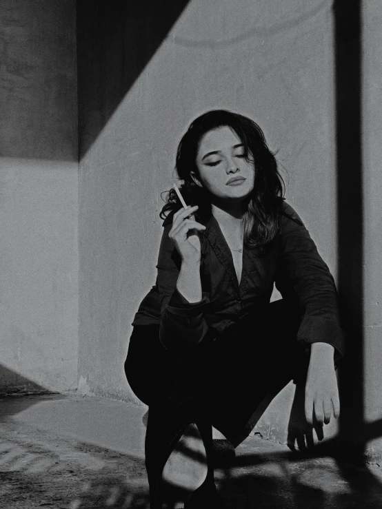 a black and white photo of a woman talking on a cell phone, by Alejandro Obregón, cinematic. by leng jun, joey king, cindy avelino, posed