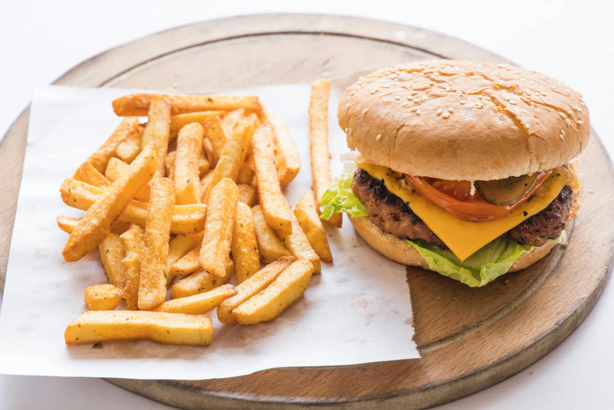 a hamburger and french fries on a plate, a portrait, unsplash, 🦩🪐🐞👩🏻🦳, on a wooden tray, listing image, daily specials