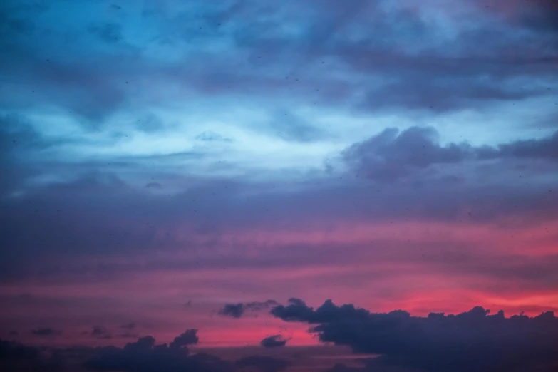 a large body of water under a cloudy sky, inspired by Elsa Bleda, pexels contest winner, romanticism, red sky blue, birds on sky, dayglo pink blue, humid evening