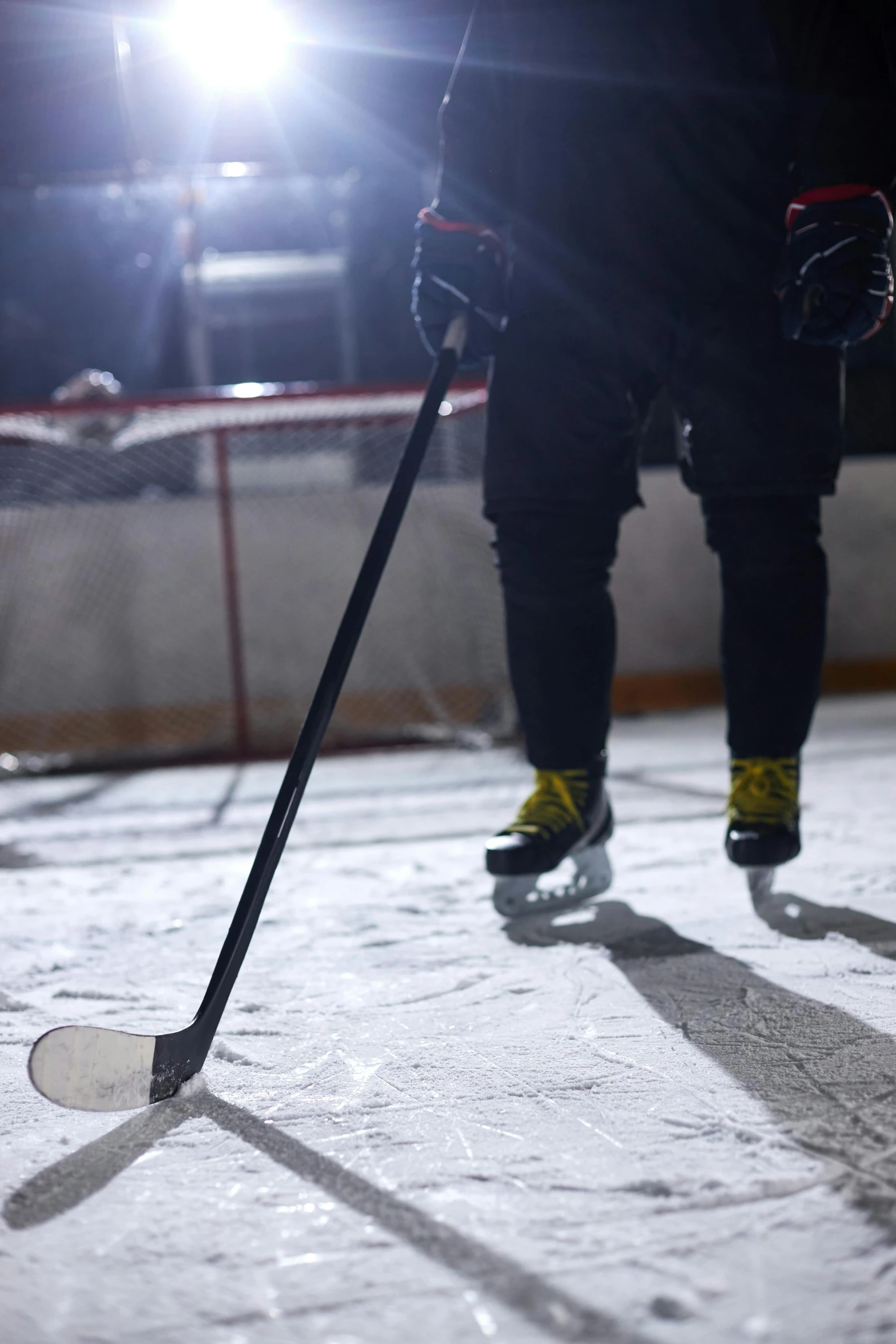 a person standing on top of an ice rink holding a hockey stick, in the spotlight, up close, game ready, instagram post