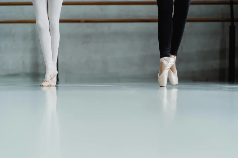 a couple of ballerinas standing next to each other, trending on pexels, arabesque, studio floor, blank, thumbnail, white