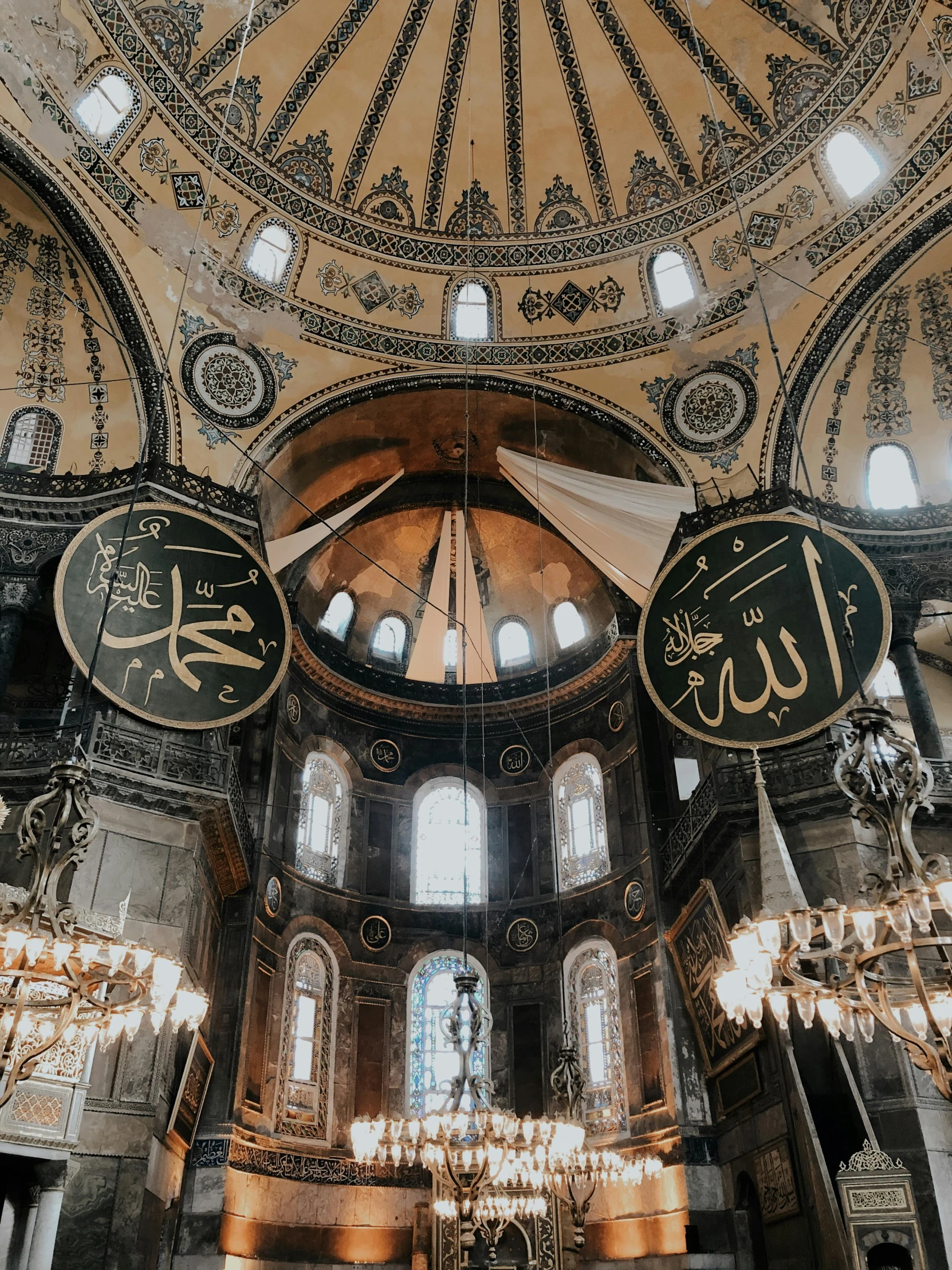 the inside of a building with chandeliers hanging from the ceiling, a photo, trending on unsplash, hurufiyya, minarets, 🚿🗝📝, byzantine mosaic, gif