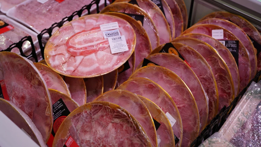 a display case filled with lots of different types of meat, pexels, plasticien, magnificent oval face, covered in pink flesh, thumbnail, ham