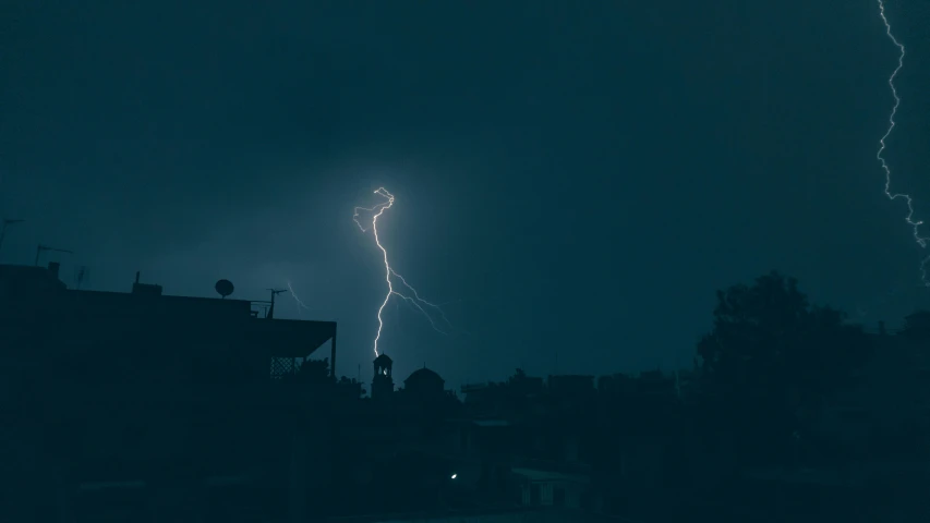 a black and white photo of a lightning bolt, by Romain brook, pexels contest winner, hurufiyya, blue and yellow lighting, thunderstorm in marrakech, ☁🌪🌙👩🏾, photograph taken in 2 0 2 0