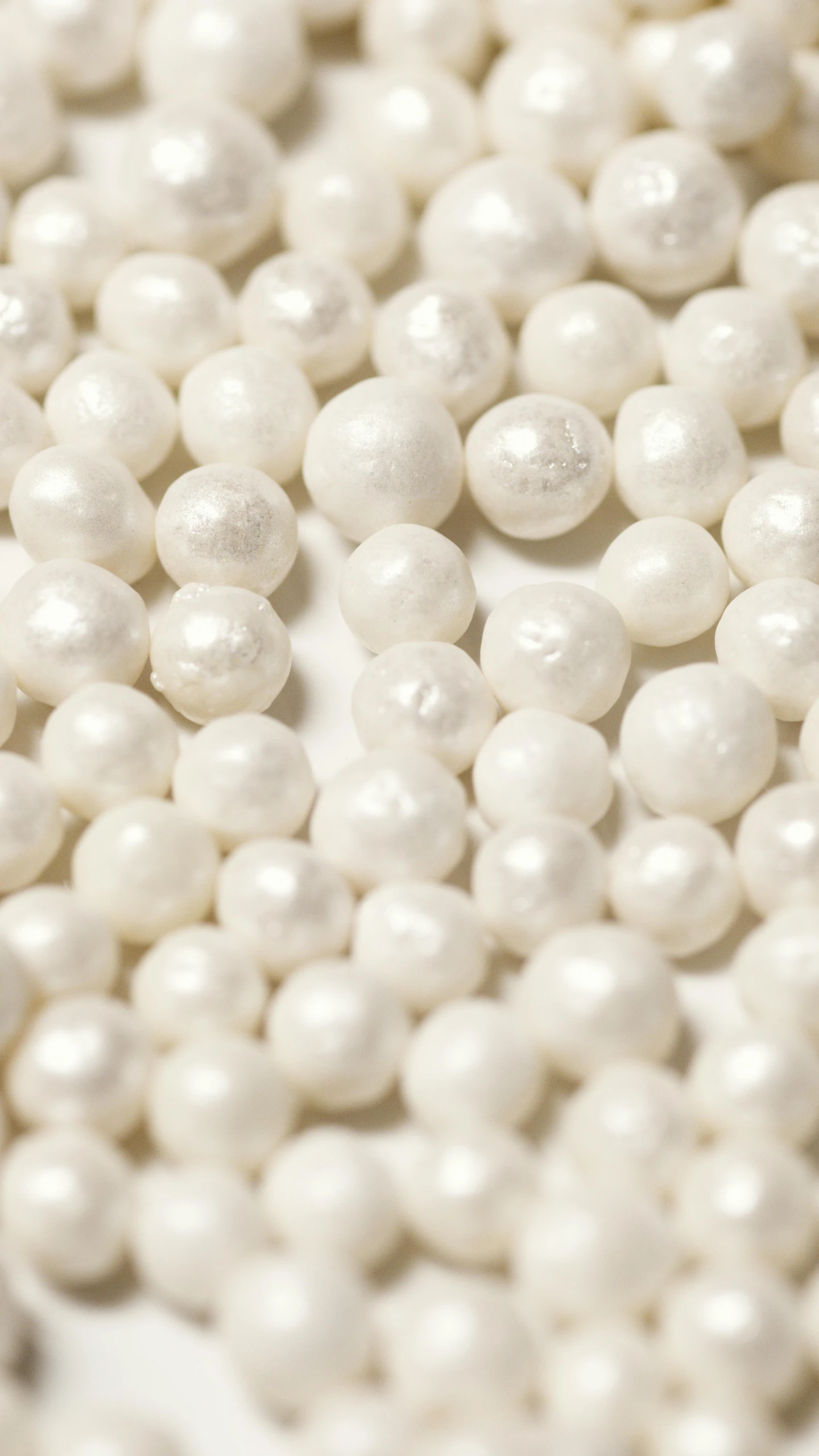 a pile of white pearls sitting on top of a table, miniature product photo, thumbnail, inputs, white: 0.5