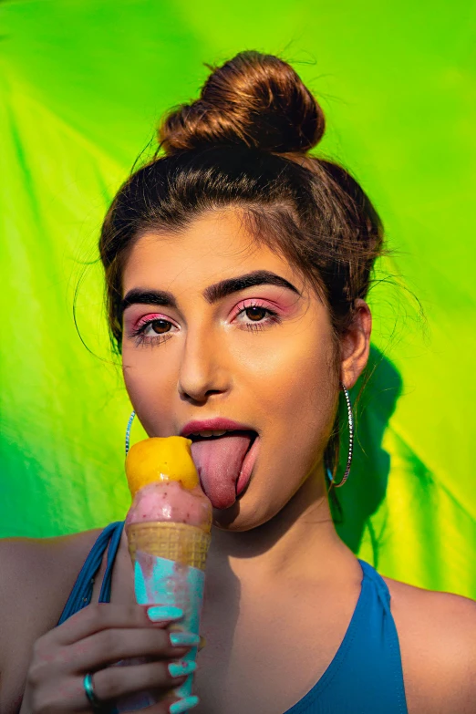 a woman sticking her tongue out while eating an ice cream, inspired by Elsa Bleda, trending on pexels, pop art, young middle eastern woman, nonbinary model, inflatable, ( ( ( colorful ) ) )