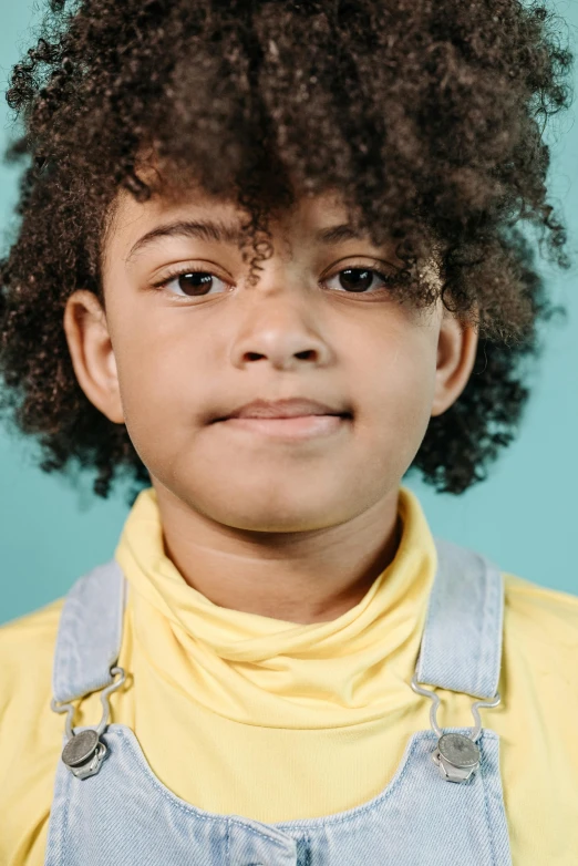 a young boy wearing overalls and a yellow shirt, a character portrait, pexels, renaissance, afro futuristic, photo of the girl, wearing a light blue shirt, child hybrid