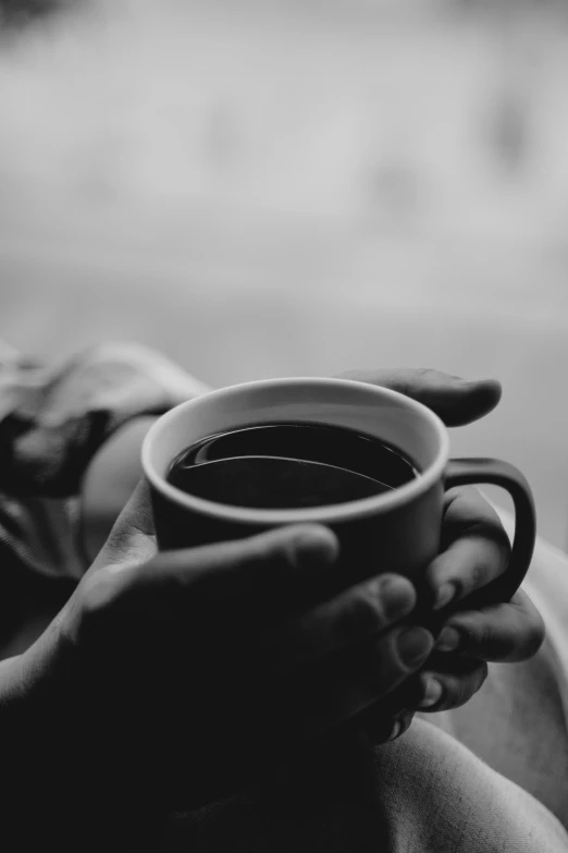 a person holding a cup of coffee in their hands, a black and white photo, pexels contest winner, romanticism, :: morning, promo image, drinking cough syrup, evening time