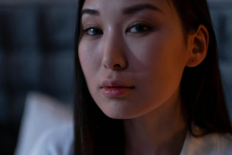 a woman sitting in front of a laptop computer, a character portrait, inspired by Feng Zhu, trending on pexels, hyperrealism, soft evening lighting, serious face, ethnicity : japanese, bedroom eyes