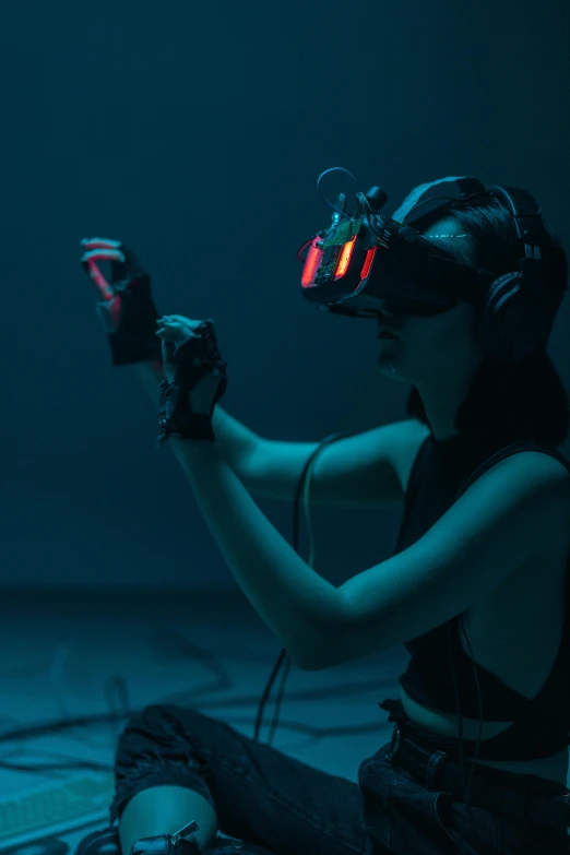 a woman sitting on the ground playing a video game, a hologram, inspired by Simon Stålenhag, unsplash, interactive art, volumetric underwater lighting, wearing a gaming headset, motion capture system, avatar image