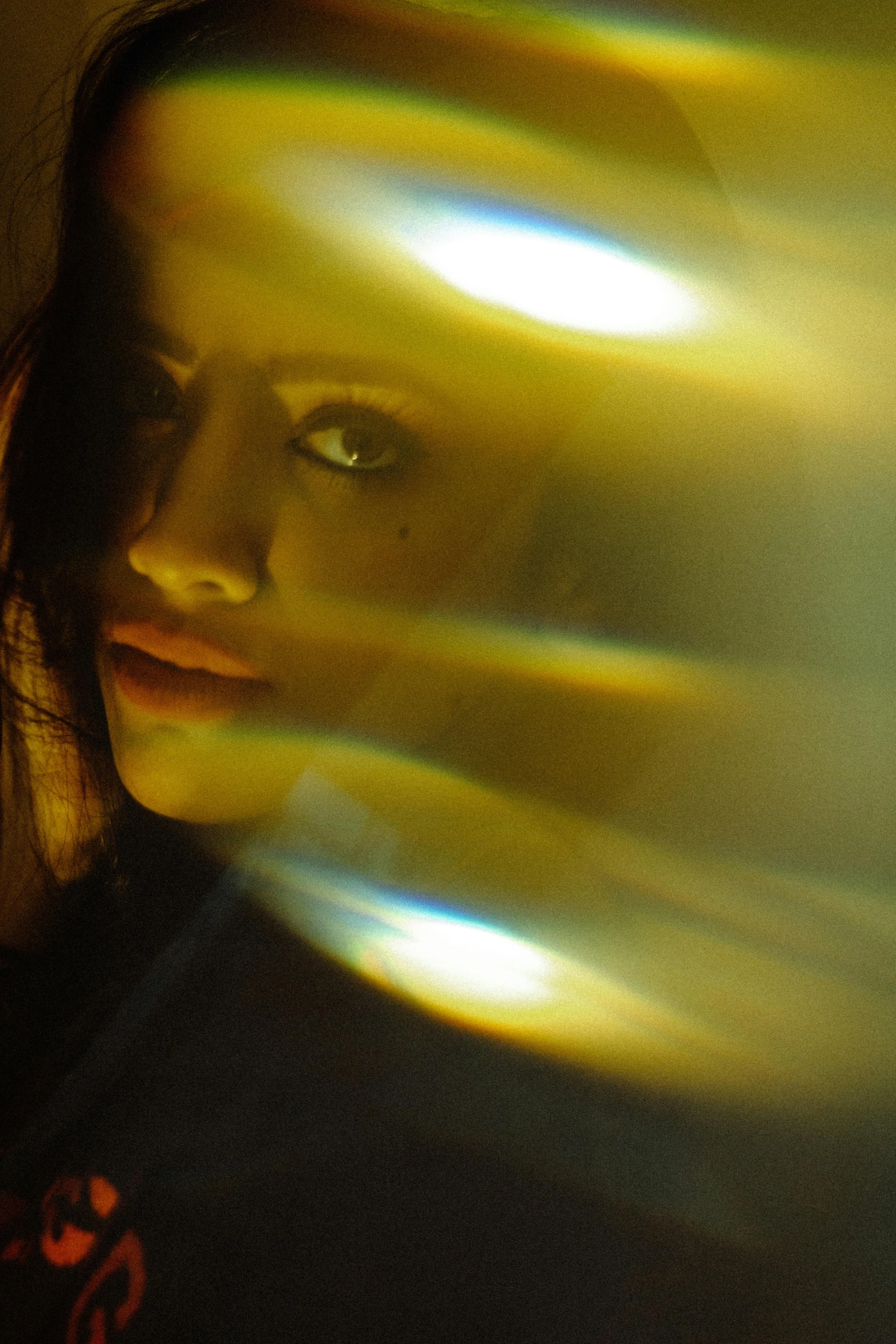 a close up of a person holding a cell phone, a picture, inspired by Elsa Bleda, renaissance, yellow aura, brunette woman, reflective light, movie filmstill