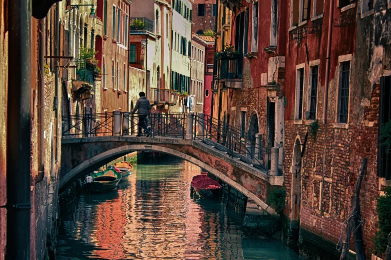 a couple of boats that are in the water, a picture, inspired by Quirizio di Giovanni da Murano, pexels contest winner, renaissance, on a bridge, shady alleys, 2022 photograph, multicoloured