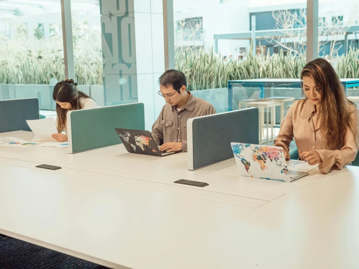 a group of people sitting at a table with laptops, a cartoon, unsplash, background image, office furniture, ground level shot, hoang lap