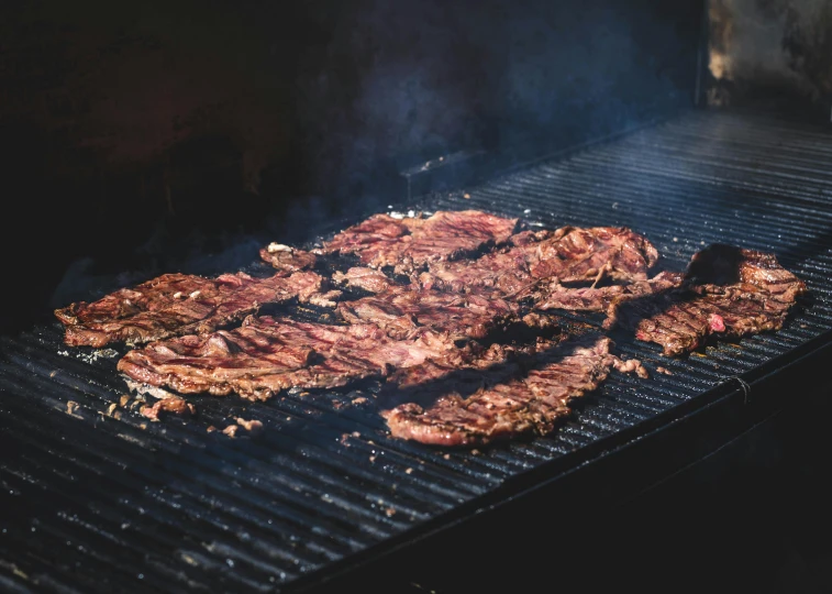 steaks cooking on a grill with smoke coming out of them, by Daniel Lieske, pexels contest winner, shaded, 5 feet away, with intricate detail, stacked image