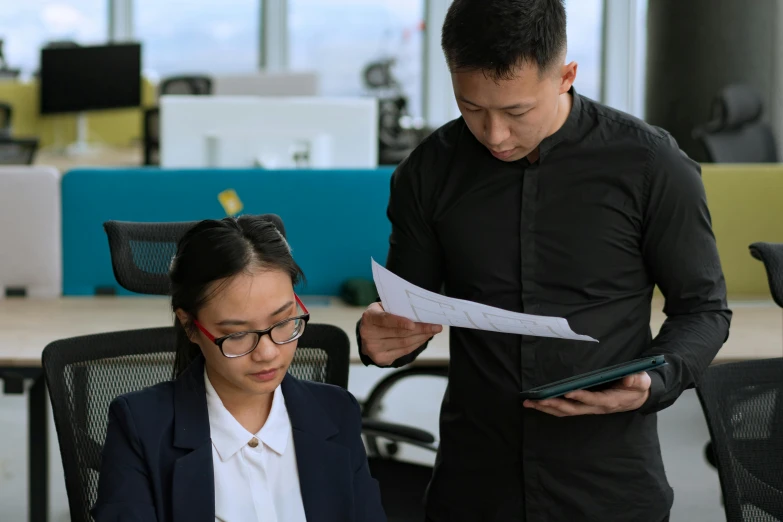 a man and a woman looking at a piece of paper, a cartoon, by Reuben Tam, pexels contest winner, in an office, hoang lap, wearing causal black suits, avatar image