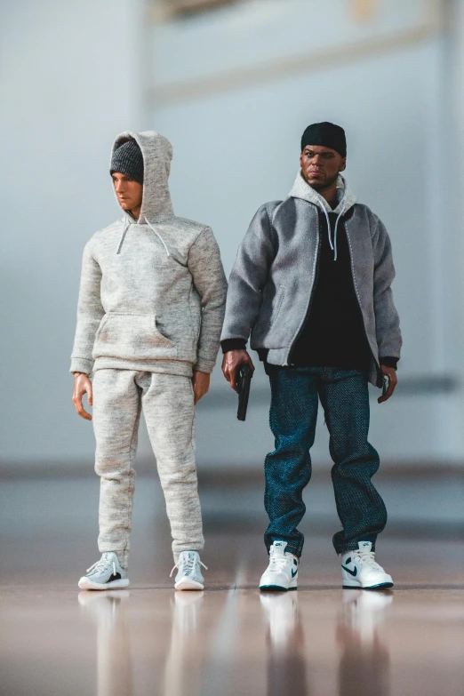 a couple of action figures standing next to each other, by mckadesinsanity, trending on cg society, realism, wearing a hoodie and sweatpants, hyper detailed hyper detailed, diverse outfits, with black beanie on head