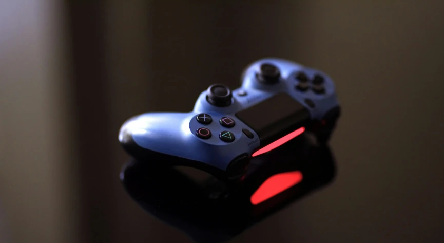 a close up of a video game controller, pexels, blue colors with red accents, with dramatic lighting, instagram post, playstation 4