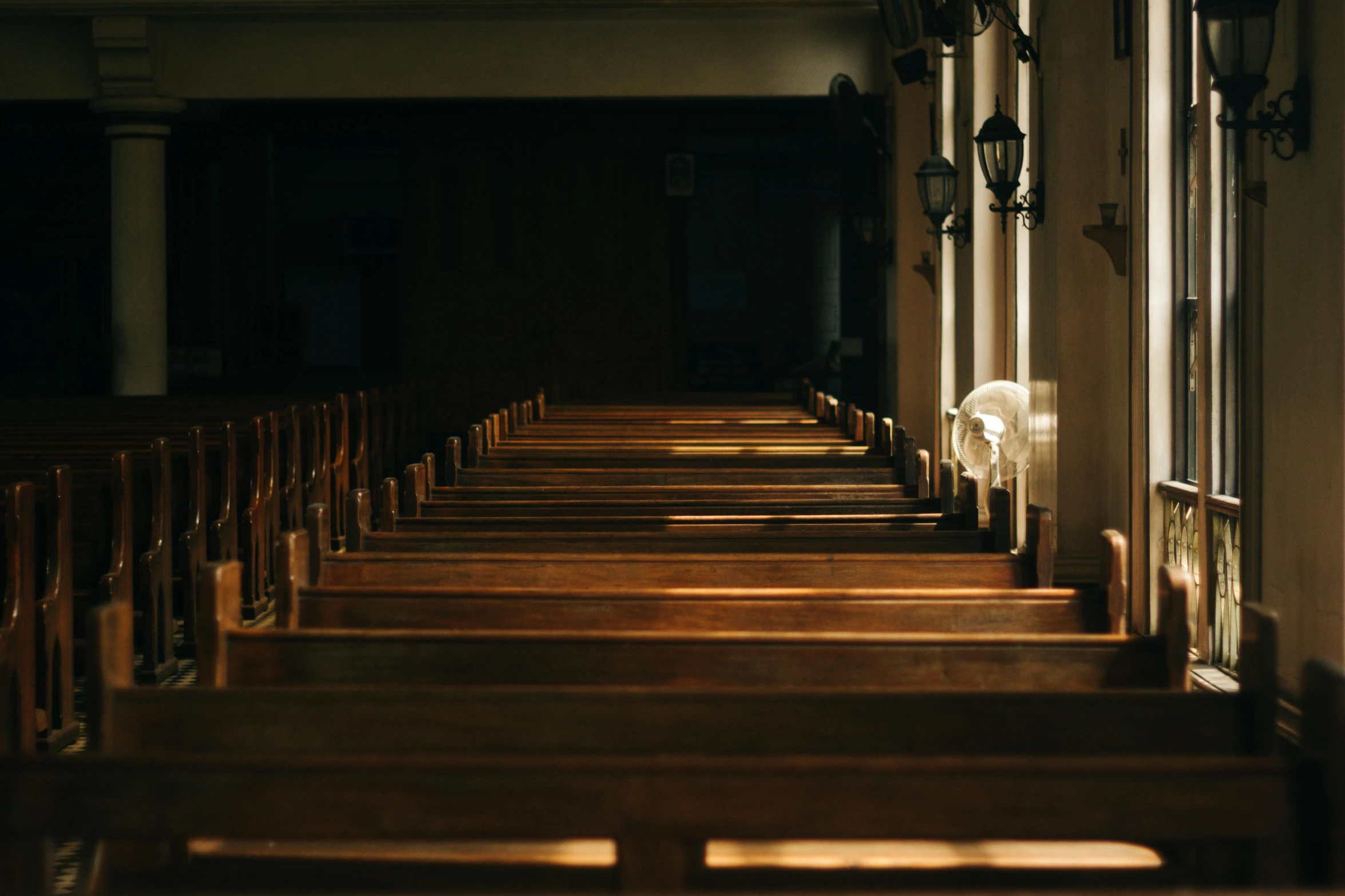 a row of wooden pews in a church, by Carey Morris, pexels, late afternoon light, instagram post, grieving, single