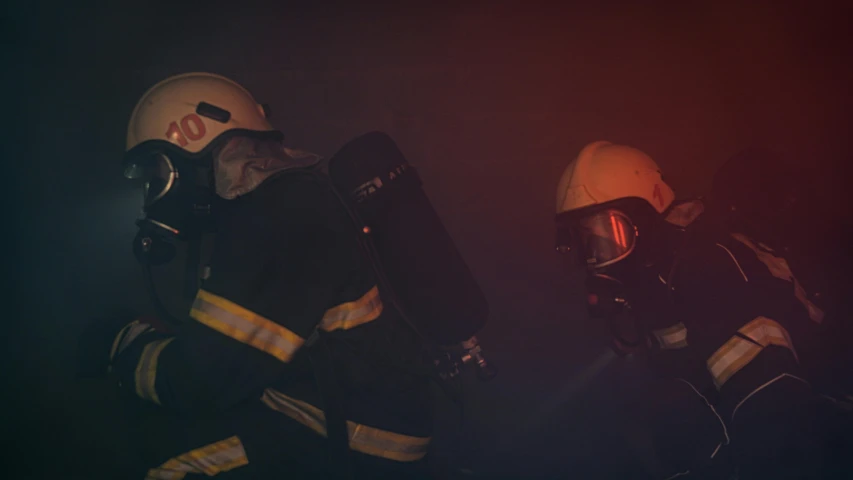 a couple of firemen standing next to each other, a picture, pexels contest winner, happening, avatar image, dimly lit, panoramic shot, descent