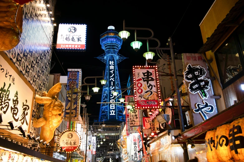 a group of people walking down a street next to tall buildings, a photo, ukiyo-e, neon lights above shops, advertising photo, japan tokyo skytree, thumbnail