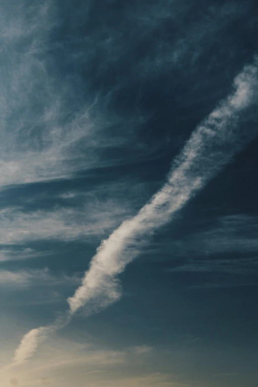 a plane that is flying in the sky, by Andries Stock, pexels contest winner, aestheticism, spiral clouds, trailing white vapor, 15081959 21121991 01012000 4k, alessio albi