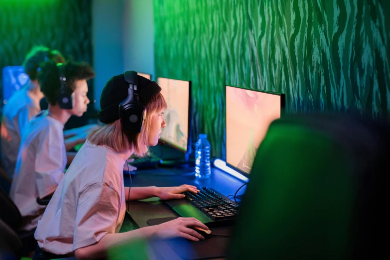 a group of people playing a game on a computer, green accent lighting, girl wearing headphones, profile image, upscaled