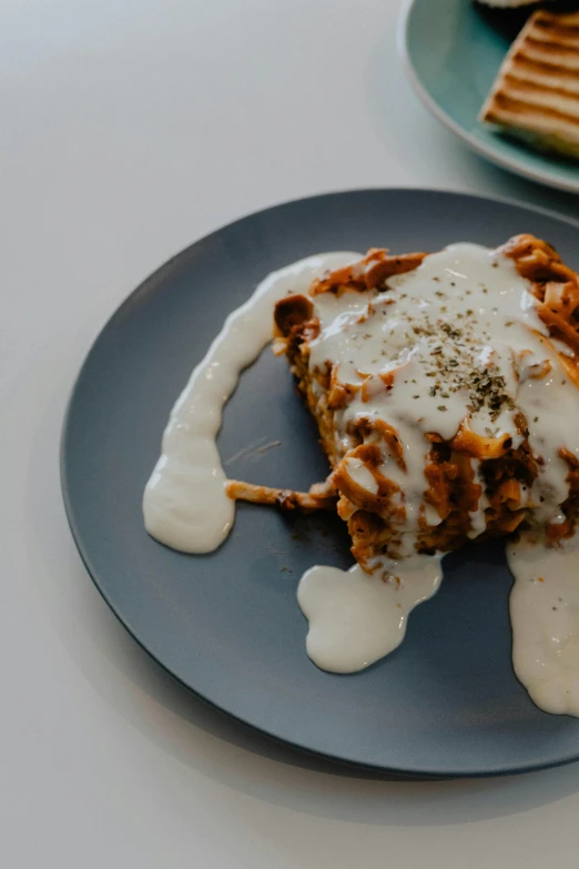 a close up of a plate of food on a table, a digital rendering, by Matt Cavotta, trending on unsplash, lasagna, puddle of milk, greece, thumbnail