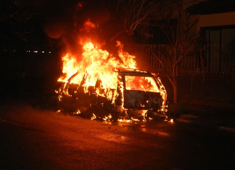 a car that is on fire in the street, flickr, 2006 photograph, van, vandalism, 2 0 0 4 photograph