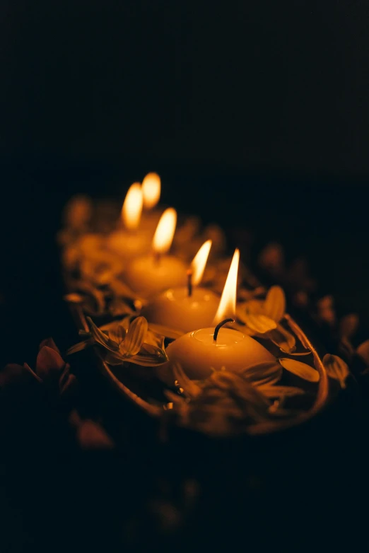 a group of lit candles sitting on top of a table, profile image, digital image, dark. no text, funeral