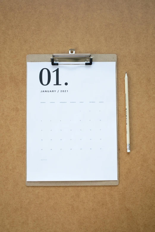 a clipboard sitting on top of a table next to a pen, by Jessie Algie, female calendar, behance lemanoosh, thumbnail, 1 as january