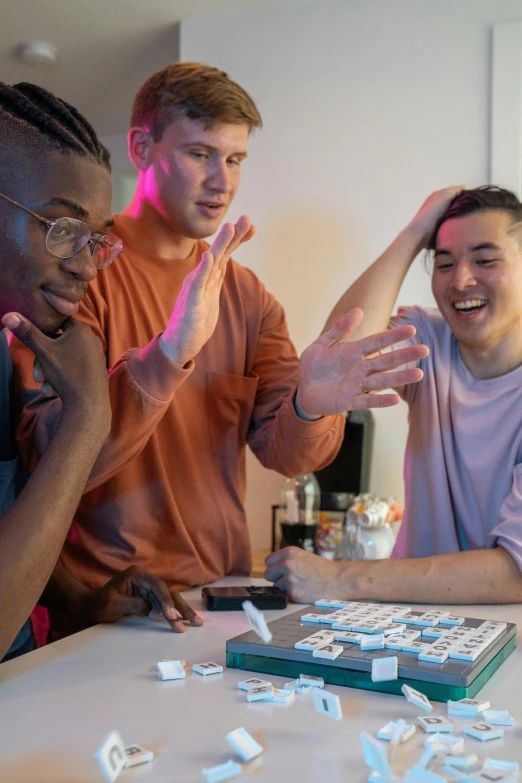 a group of men sitting around a table playing a game of sud sud sud sud sud sud sud sud sud sud sud sud sud sud sud sud, trending on reddit, happening, college students, high quality photo, photograph of three ravers, lgbtq