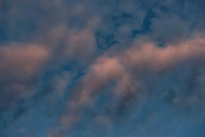 a large jetliner flying through a cloudy blue sky, an album cover, by Jan Rustem, unsplash, romanticism, pink clouds, ignant, late evening, a close-up