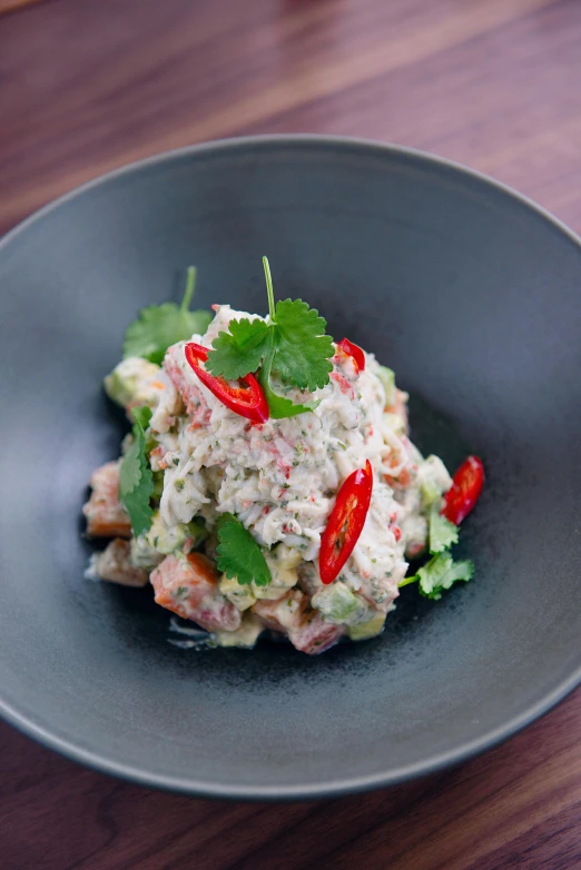 a close up of a plate of food on a table, crustacean, square, grey, in style of thawan duchanee