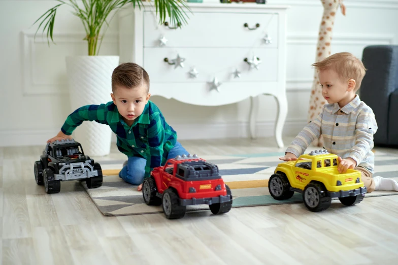 two small children playing with toy cars on the floor, pexels contest winner, standing sideways, off-roading, looking towards camera, police cars