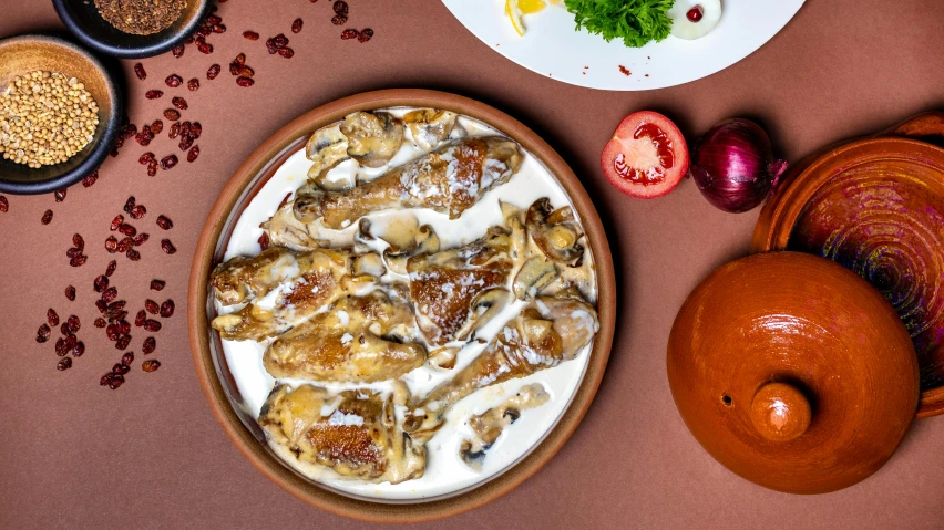 a plate of food sitting on top of a table, spread wings, brown, background image, nuri iyem