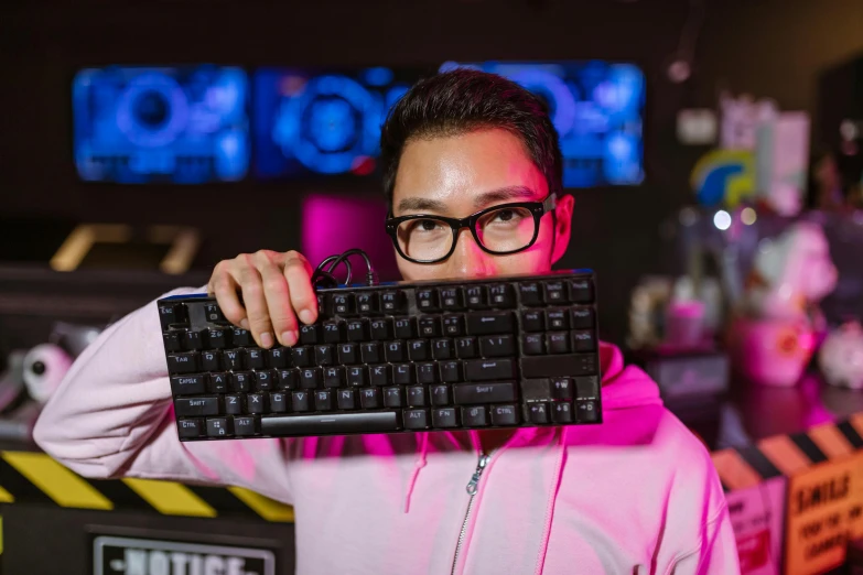 a man holding a keyboard in front of his face, a portrait, by Dan Content, reddit, kda and sam yang, server in the middle, profile image, holding a pudica pose