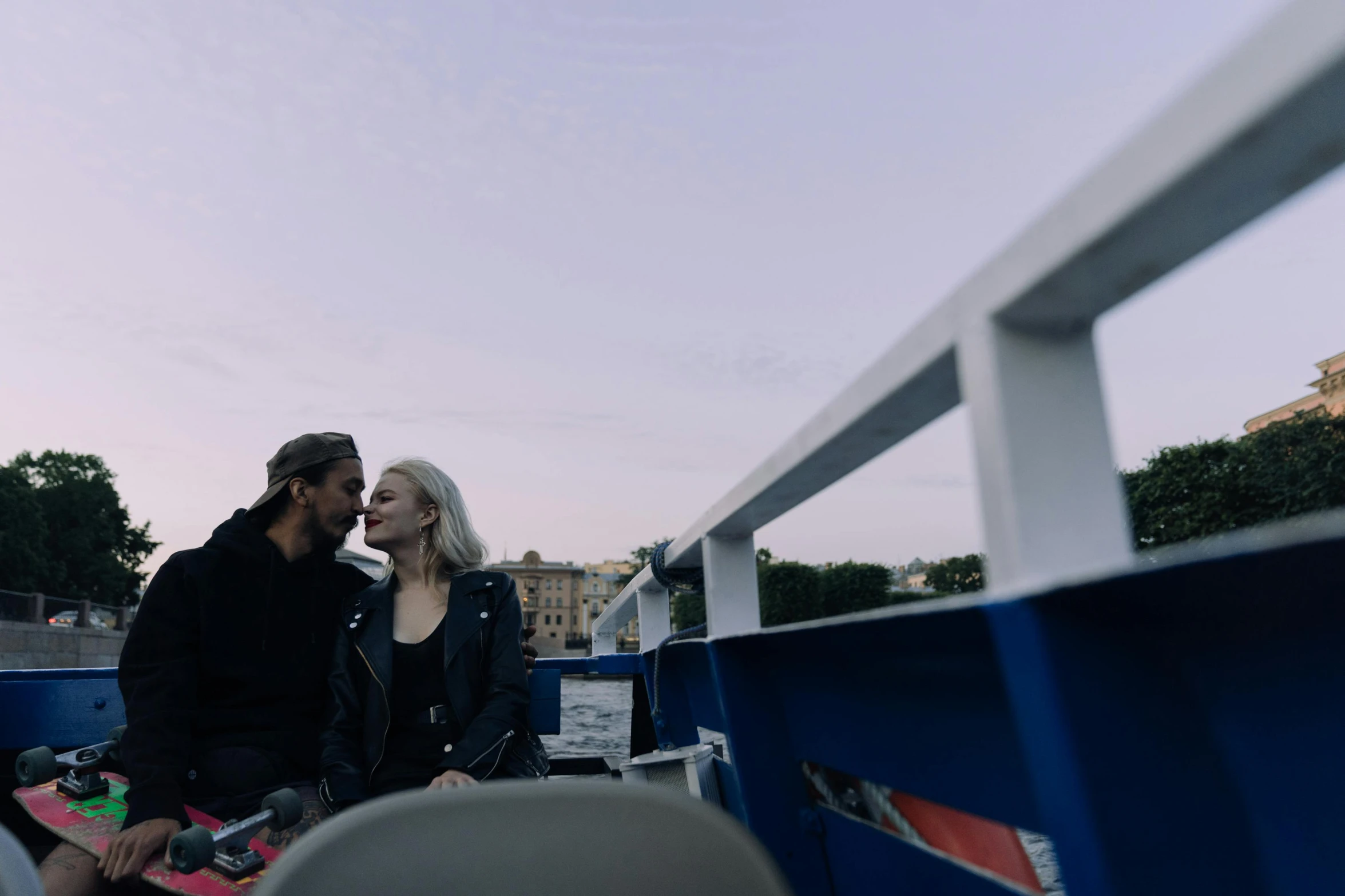 a man and a woman sitting on a boat, pexels, happening, anya taylor - joy, fan favorite, kirsi salonen, couple kissing