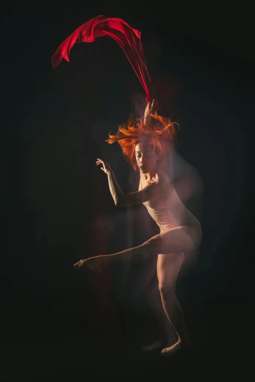 a woman with red hair dancing in the dark, a portrait, inspired by Elizabeth Polunin, pexels contest winner, conceptual art, orange spike aura in motion, lois greenfield, tendrils of colorful light, medium format. soft light