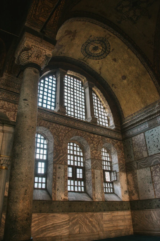 the inside of an old building with lots of windows, a mosaic, inspired by Abraham van den Tempel, trending on unsplash, romanesque, istanbul, 2 5 6 x 2 5 6 pixels, historical photo, in an ancient altar