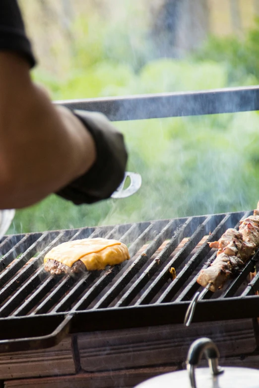 a person is cooking food on a grill, square, teaser, brown, grey