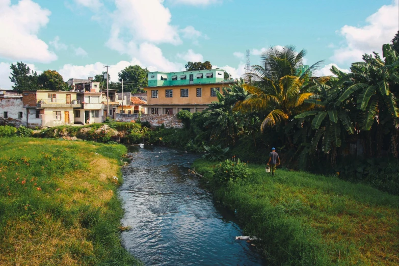 a river running through a lush green field, by Daniel Lieske, pexels contest winner, standing in a township street, jamaican vibe, ginger, 🦑 design