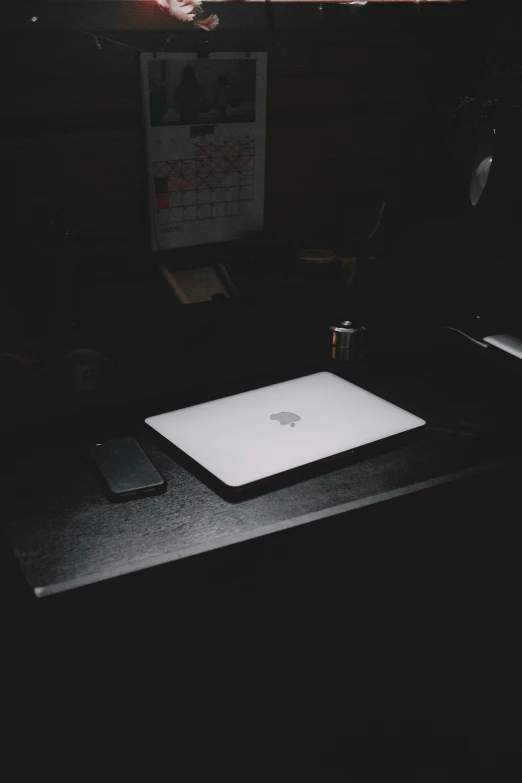 a laptop computer sitting on top of a desk, by Elsa Bleda, lurking in the darkness, trending on vsco, white on black, iphone picture